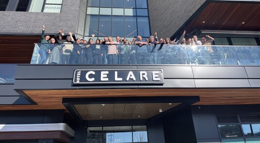 a group of people standing on a balcony