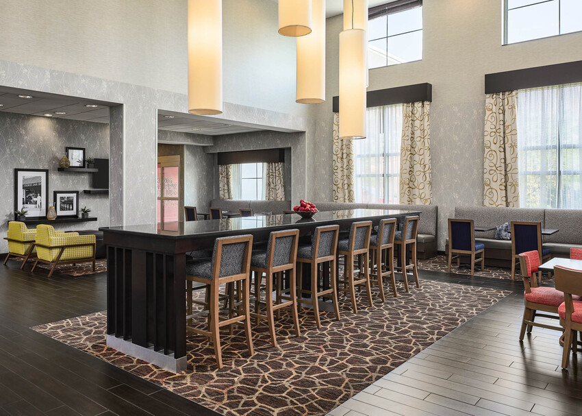 a room with a long table and chairs