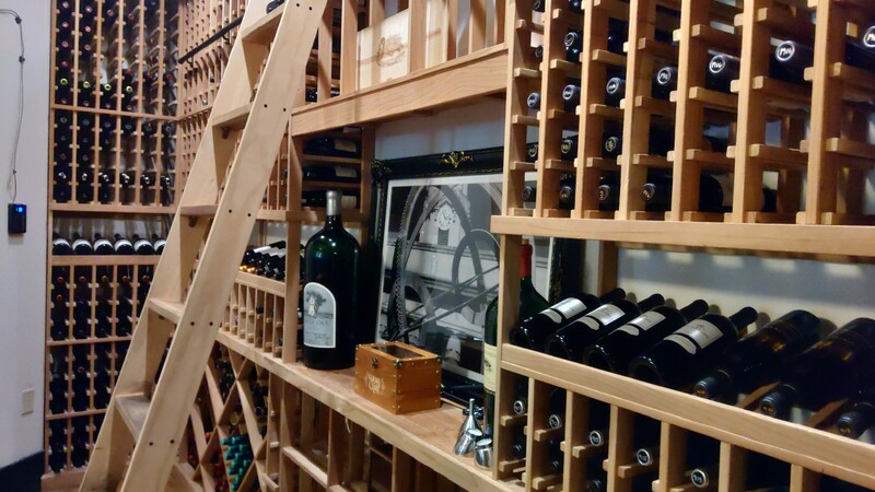 a wine rack with bottles of wine