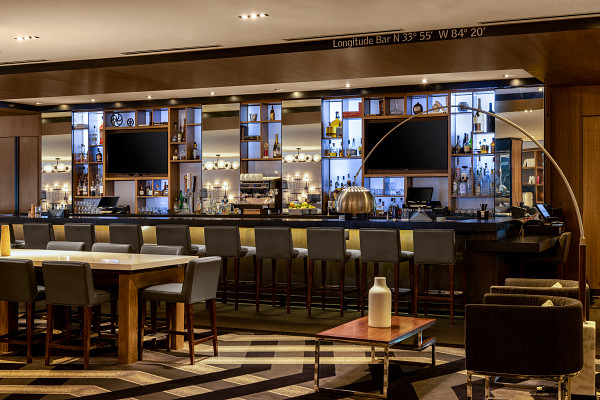 a bar with a television and shelves